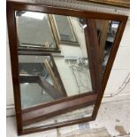 A mahogany framed rectangular wall mirror of plain form 66.