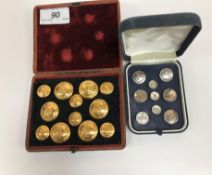 A set of brass buttons depicting lyre type instruments,