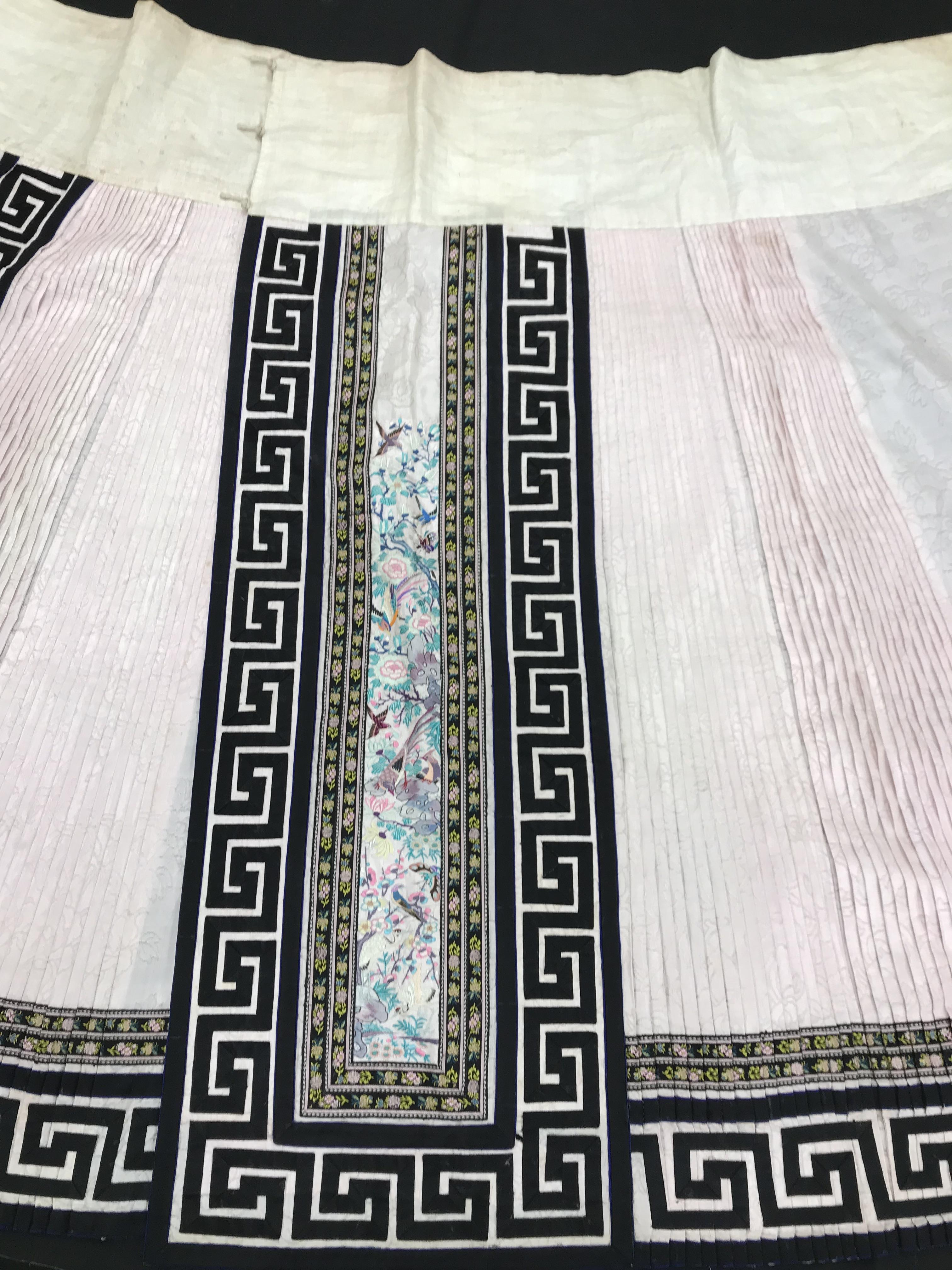 A Chinese silk skirt in two panels with a pink background overlaid with borders of Greek key type - Image 6 of 21
