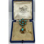 A Victorian yellow metal and turquoise mounted brooch set with eight small simulated diamonds and