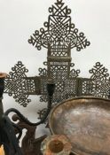 A collection of various metal wares to include an Eastern white metal pierced cross 74.