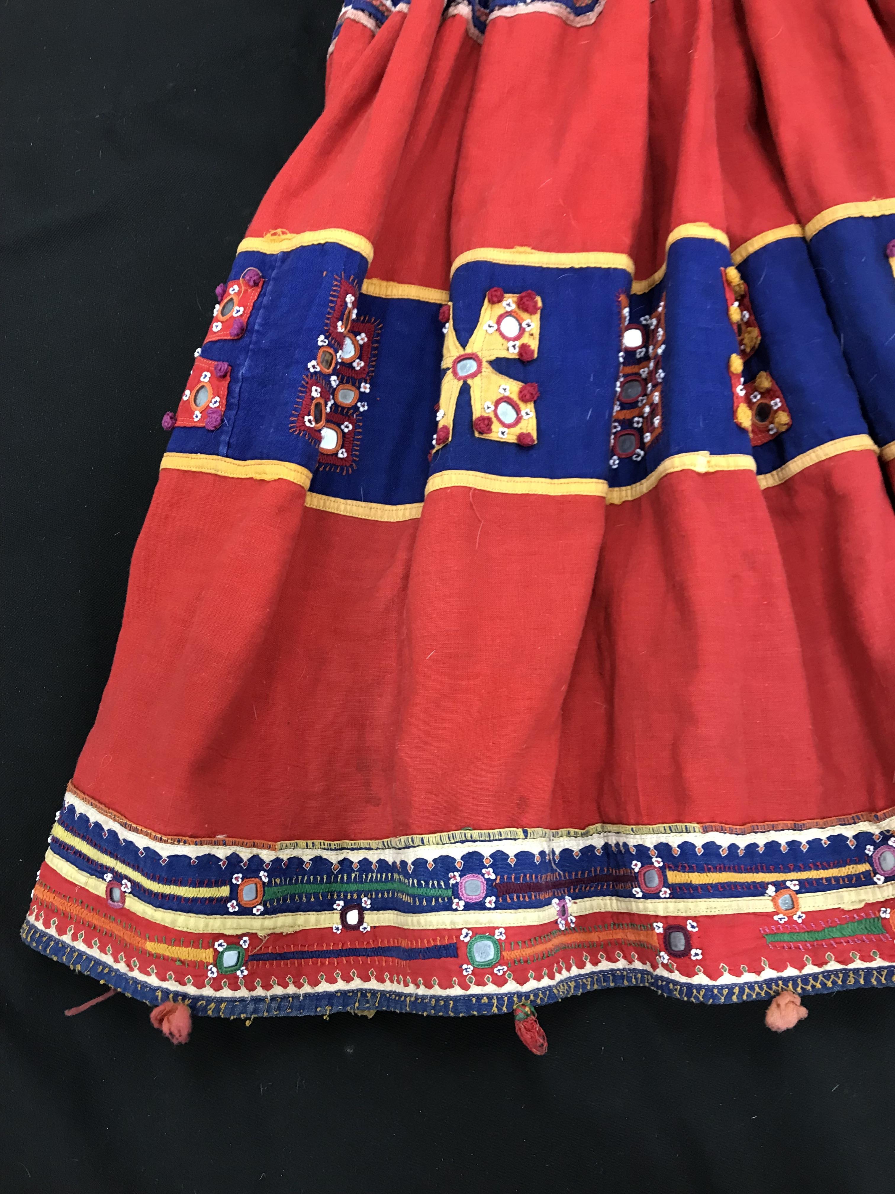 A Rajhistani skirt in red and blue stripes with overlaid embroidery and mirrored decorations, - Image 4 of 14
