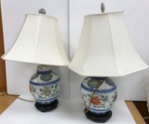 A pair of Chinese ginger jar design polychrome decorated porcelain table lamps and shades together