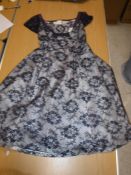 A circa 1950s New Look style cocktail dress with blue lace overlay and full petticoat together with