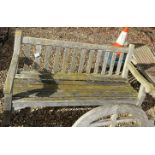 A teak slatted garden bench seat,