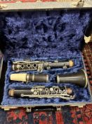 An F Buisson Dallas 90 clarinet with hard case and a vintage mandolin (un-named)