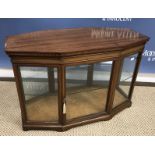 An Edwardian mahogany Sheraton Revival display cabinet or bijouterie cabinet of elongated octagonal