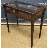 A circa 1900 mahogany and brass bound bijouterie table in the Louis Philippe taste,