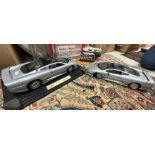 Two Maisto scale models "Jaguar XJ 220" 1/12 scale, a model of the Star Ferry Hong Kong,