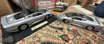 Two Maisto scale models "Jaguar XJ 220" 1/12 scale, a model of the Star Ferry Hong Kong,