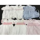 A collection of baby's and childrens' clothes,