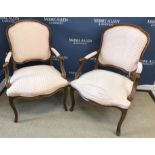 A pair of stained beech framed Duresta upholstered elbow chairs in the Louis XV taste,