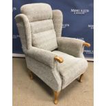 A modern upholstered wing back scroll arm chair on stained beech cabriole legs,