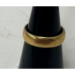 A 22 carat gold wedding band, overall weight 6.