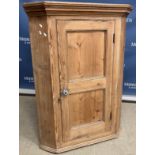 A 19th Century pine hanging corner cupboard,