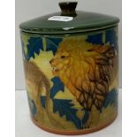 A Sally Tuffin Dennis Chinaworks cylindrical pot and cover decorated with tube-lined lions "Lion