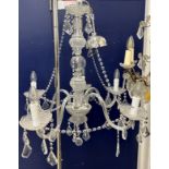 A modern cut glass five branch electrolier with hanging drops,