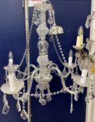 A modern cut glass five branch electrolier with hanging drops,