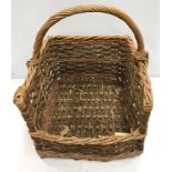 Two log baskets and a laundry type basket and a brass oil lamp converted to electric