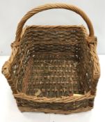 Two log baskets and a laundry type basket and a brass oil lamp converted to electric