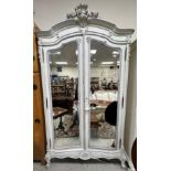 A French white painted armoire in the Louis XV style,