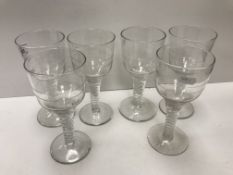 A set of six late 19th Century / early 20th Century engraved glass wines,