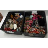 Two crates of costume jewellery including necklaces, pendants, earrings,