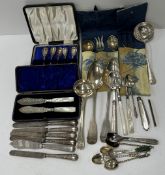 A collection of silver and silver plated cutlery to include a pair of "Fiddle" pattern serving