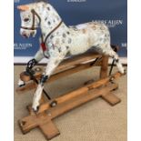 A circa 1900 dapple painted rocking horse "Cristabel" of small proportions,