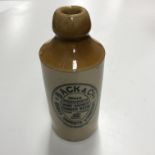 A box containing various stoneware/salt glazed beer bottles including Thomas's Stone Beer,