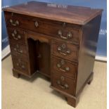 A late George III mahogany bachelor's kneehole desk,