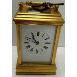 A 20th Century French gilt brass cased carriage clock, the movement of typical form,