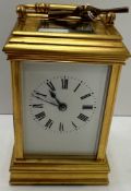 A 20th Century French gilt brass cased carriage clock, the movement of typical form,