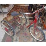 A vintage Triang trike of typical form with panier,