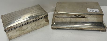 A mid 20th Century silver cigarette box with hinged lid of rectangular flared form,