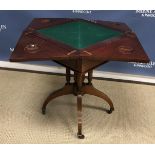 An Edwardian mahogany envelope card table with single frieze drawer on cluster column support to