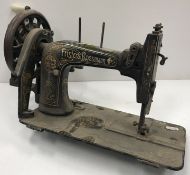 Three vintage sewing machines (sold for decorative purposes only) to include a Singer 15K treadle