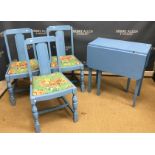 A blue painted drop-leaf kitchen table, three blue painted chairs,