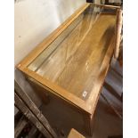 A mid to late 20th Century oak museum style glazed display table with shallow sloping top and