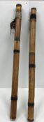 A pair of Eastern bamboo ceremonial shakers/rattles with beaded decoration 90 cm long together with