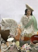 A collection of Staffordshire pottery flat back figures and spill vases including figure of