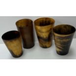 A collection of four various 19th Century horn beakers,