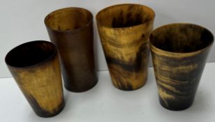 A collection of four various 19th Century horn beakers,