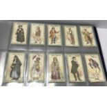 Three albums of various cigarette cards including Players "Characters from Thackeray" (25),