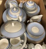 A modern Doulton pale blue and gilt banded dinner/tea service designed by Bruce Oldfield (circa