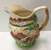 A Fieldings Crown Devon musical jug "Om Die Kampvuur" depicting South African settlers campsite,