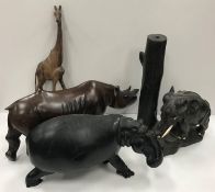 A collection of mainly African carved treen ware animal figures including hippopotamus, elephants,