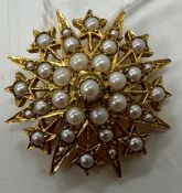 A 9 carat gold pearl set star burst brooch 3 cm wide, 8.