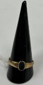 An unmarked yellow metal seal ring set with oval cut bloodstone, 3 g,