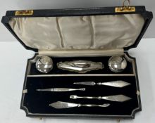 A George VI cased silver mounted manicure set (by Sanders & Mackenzie,